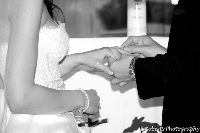 Exchanging rings during the marriage ceremony - wedding photography sydney